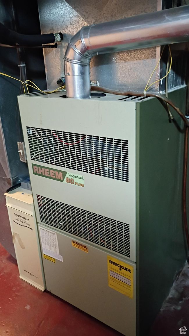Utility room featuring heating unit | Image 53