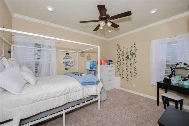 Bedroom featuring baseboards, carpet floors, crown molding, and recessed lighting | Image 20