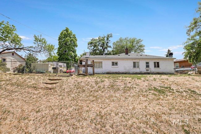 Rear view of property featuring a chimney | Image 28