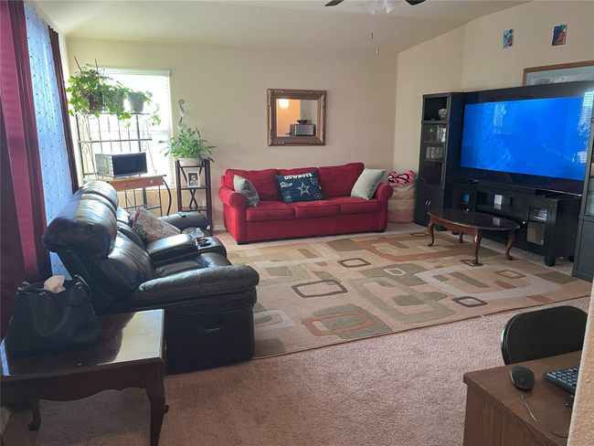 Living room/Bonus room upstairs featuring ceiling fan and light carpet | Image 10
