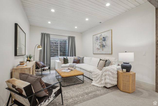 Living room featuring baseboards, carpet flooring, wood ceiling, and recessed lighting | Image 41