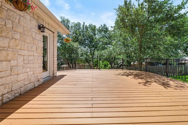 With plenty of room for dining, lounging, and entertaining, the deck is ideal for hosting summer barbecues or relaxing with a good​​‌​​​​‌​​‌‌​‌‌​​​‌‌​​‌‌​‌​​​​​‌ book | Image 31