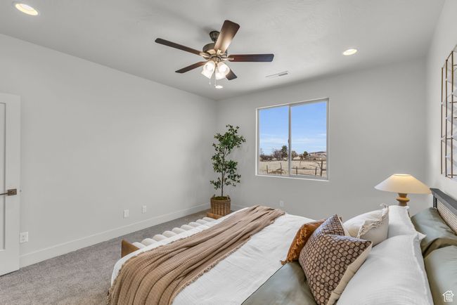 Bedroom with carpet and ceiling fan | Image 20