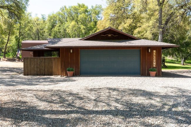garage with storage and wine cellar | Image 50