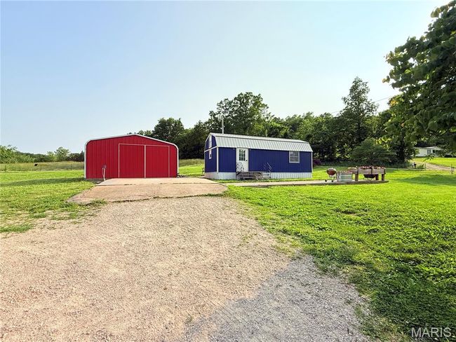 View of pole building with a yard | Image 6