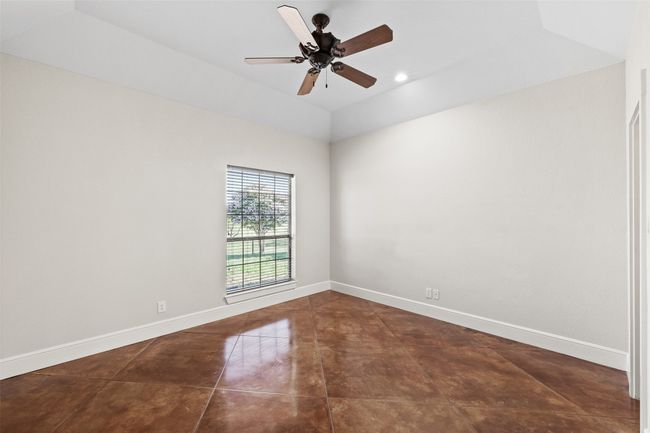Unfurnished room with vaulted ceiling, a ceiling fan, baseboards, and recessed lighting | Image 23