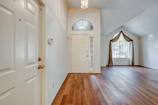 Garage entry connected to llving room. | Image 5
