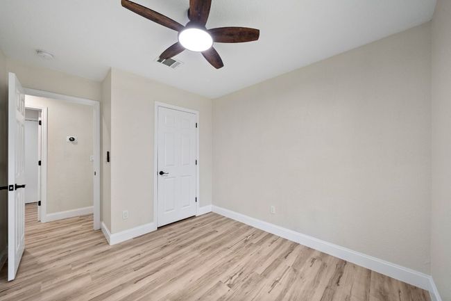 Unfurnished bedroom featuring light wood-style floors and ceiling fan | Image 24