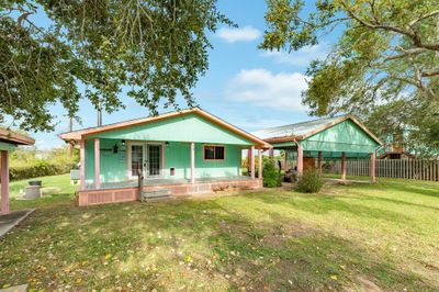 Back of house with porch and double car carport | Image 2