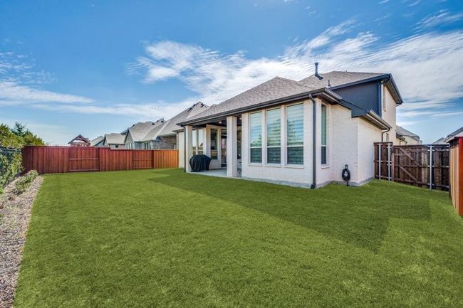 Back of property with a patio and roof with shingles | Image 36