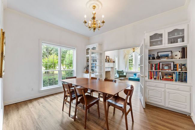 Dining space with a chandelier, built-ins healthy amount of natural light | Image 13