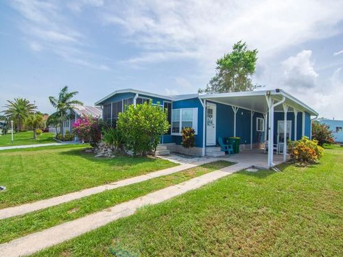 1033 Oriole Cir, Barefoot Bay, FL, 32976-7516 | Card Image