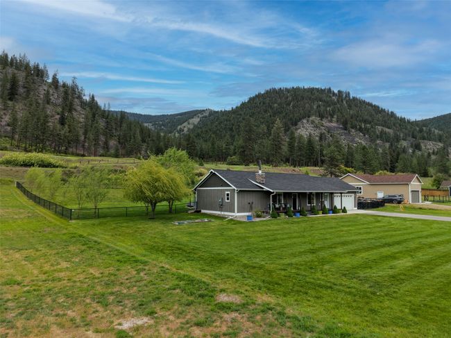 View of mountain backdrop with a heavily wooded area | Image 55