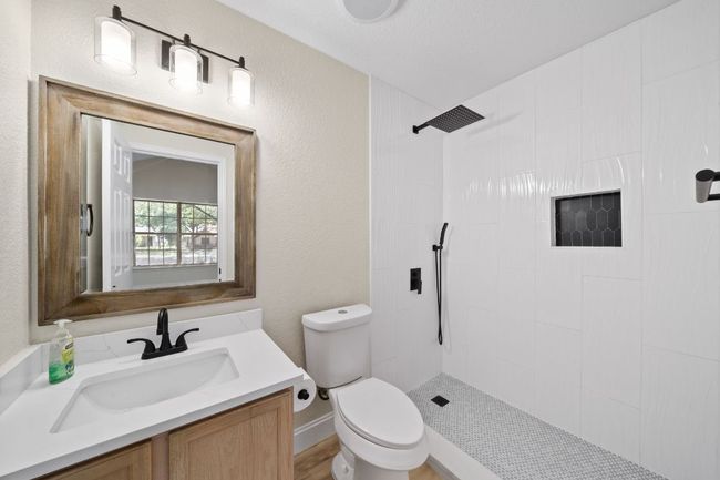 Full bath featuring a tile shower and vanity | Image 31