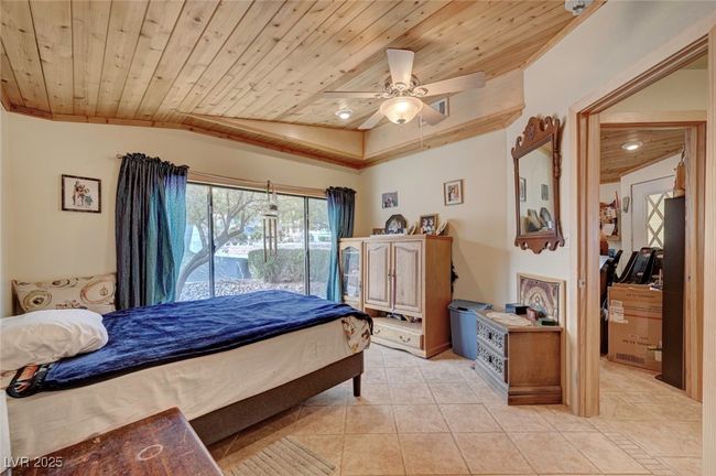 Bedroom featuring wooden ceiling, light tile patterned floors, access to exterior, and a ceiling​​‌​​​​‌​​‌‌​‌‌​​​‌‌​​‌‌​‌​​​​​‌ fan | Image 51