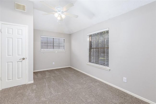 The first secondary bedroom is right off of the top of the stairs | Image 20