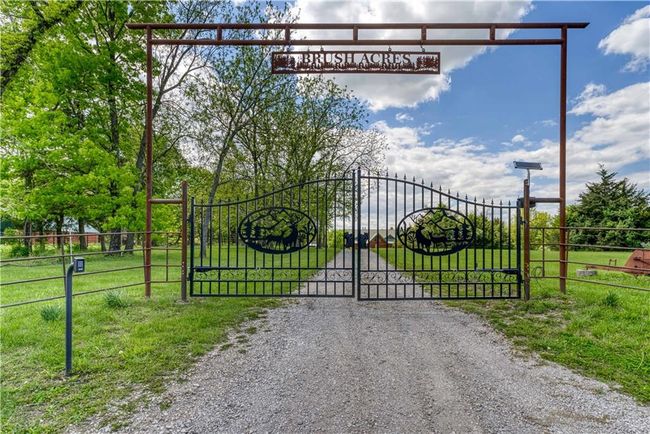 View of gate featuring fence and a lawn | Image 50
