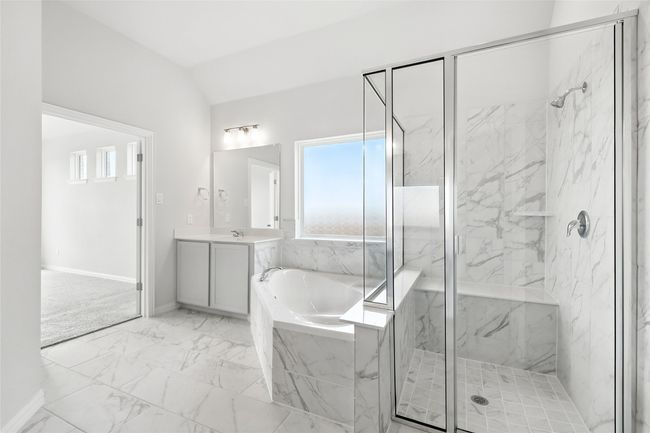 Full bathroom with a garden tub, a marble finish shower, marble finish flooring, vanity, and vaulted ceiling | Image 19