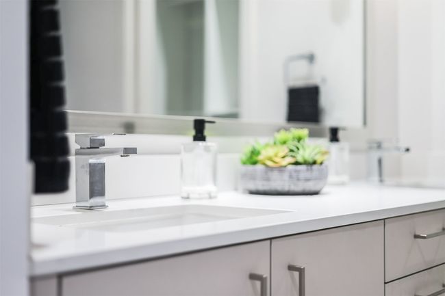 The large mirror above the vanity not only enhances the room's light but also makes the entire space feel more open and airy | Image 23