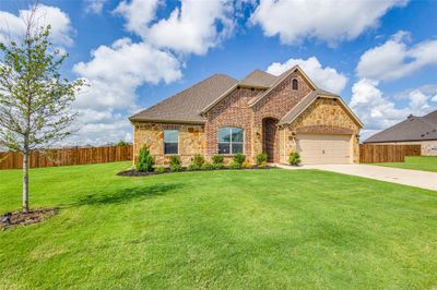 View of front of house featuring a garage and a front lawn | Image 2