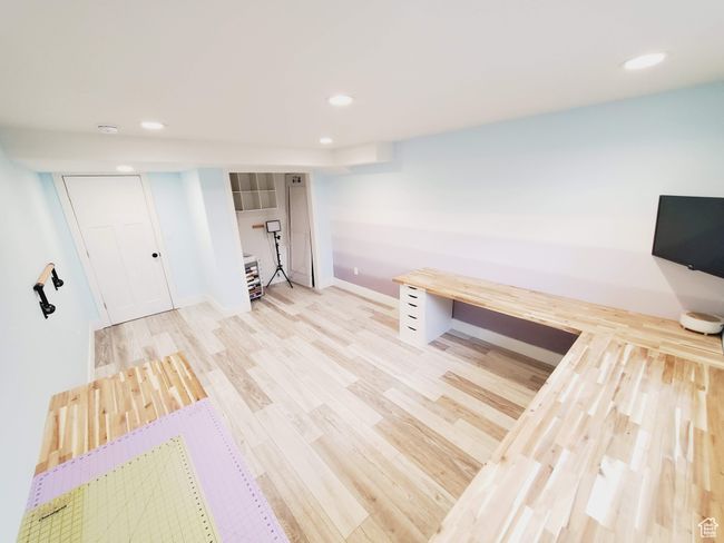 Interior space with baseboards, wood finished floors, and recessed lighting | Image 29