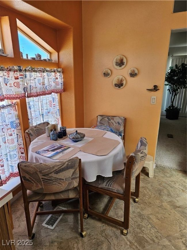 Dining room featuring visible vents | Image 23