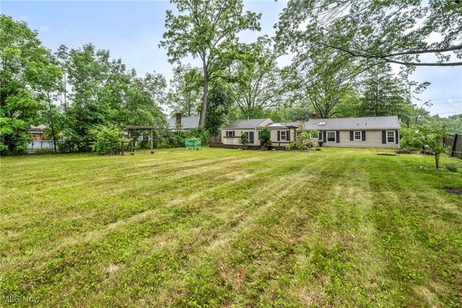 View of yard with a wooden deck | Image 41