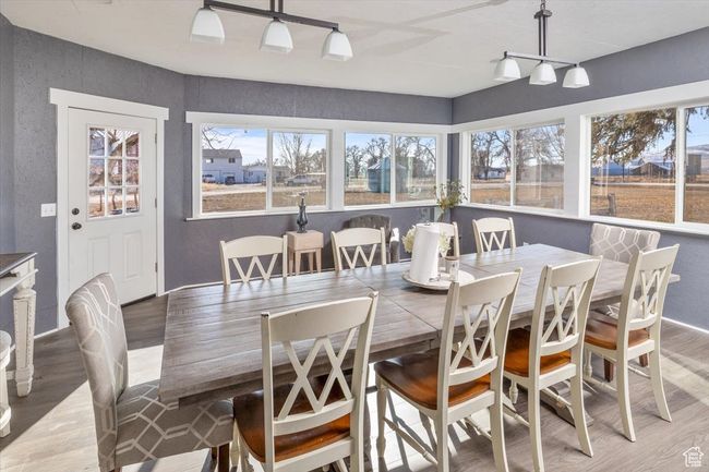Dining space featuring rail lighting and hardwood / wood-style floors | Image 12