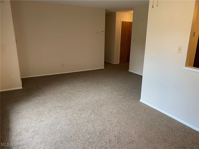Unfurnished room with baseboards and carpet flooring | Image 5