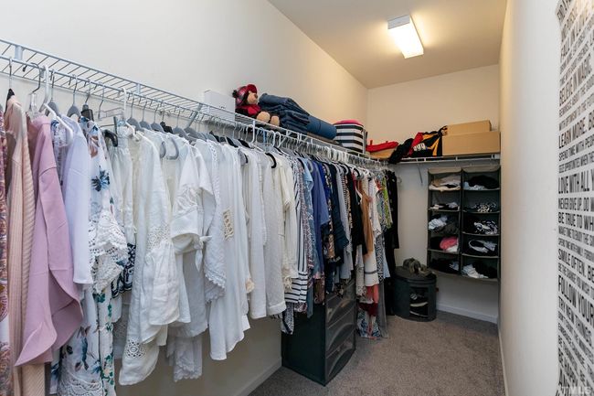 It is soooo long! You can tell this seller can't even fill it up. Plenty of room to add another shelf or alter the current rods to double racks. Just a really nice closet. | Image 26