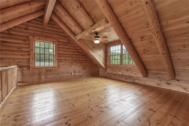Second floor loft, vaulted ceiling, exposed beams and wood floor | Image 20