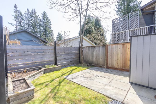 View of yard with a patio area, a vegetable garden, and a fenced backyard | Image 23