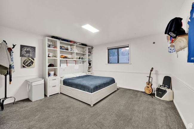 Carpeted bedroom featuring baseboards | Image 31