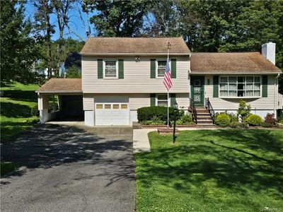 Tri-level home with a garage and car port | Image 1