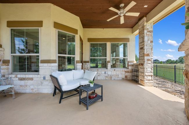 View of patio / terrace featuring a ceiling fan and outdoor lounge area | Image 25