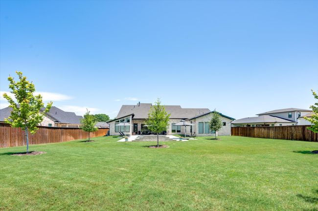 View of yard with a patio and a fenced backyard | Image 37
