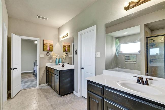 Bathroom with tile flooring, oversized vanity, and double sink | Image 21