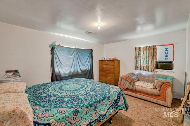 Bedroom featuring cooling unit and carpet | Image 19