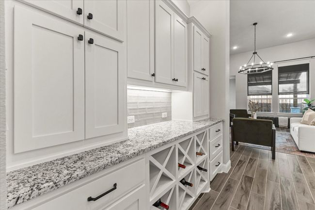 Built in custom cabinetry with wine bar, under cabinet lighting | Image 14