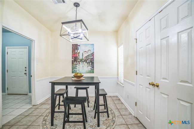 Breakfast area to Laundry area and door to garage. Don't miss the double-doors to the pantry on the right. | Image 7
