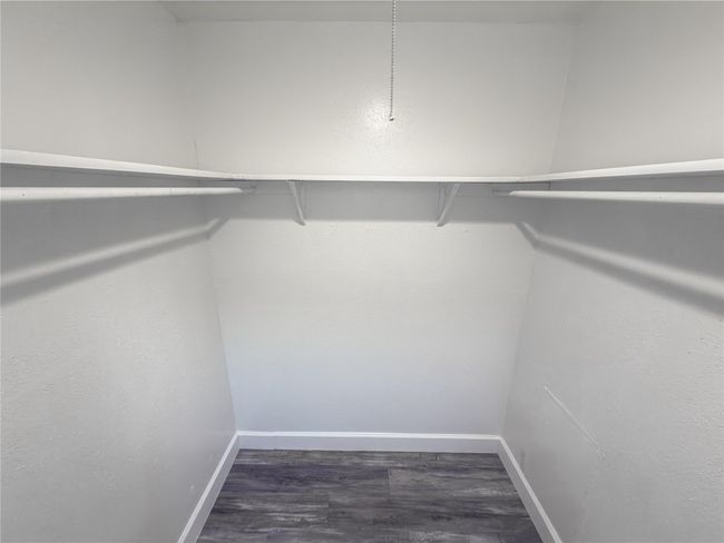 Spacious closet featuring dark hardwood / wood-style flooring | Image 15