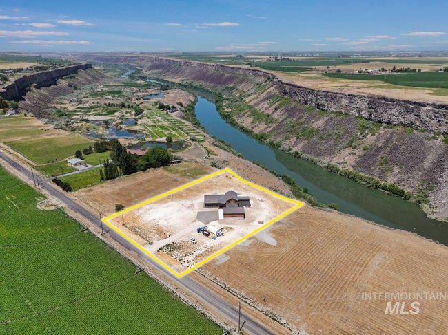 Overview of rural landscape featuring a nearby body of water and property boundaries highlighted | Image 49