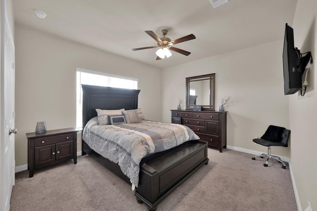 Bedroom 2 faces the front of the home. | Image 21