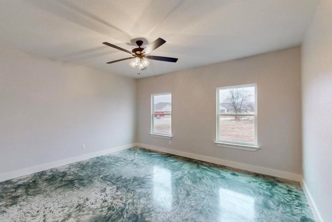 Spare room featuring baseboards and ceiling fan | Image 20
