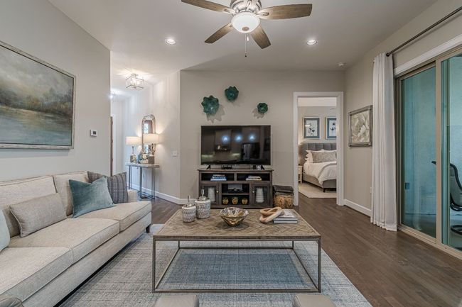 Living room with baseboards, wood finished floors, ceiling fan, and recessed lighting | Image 10