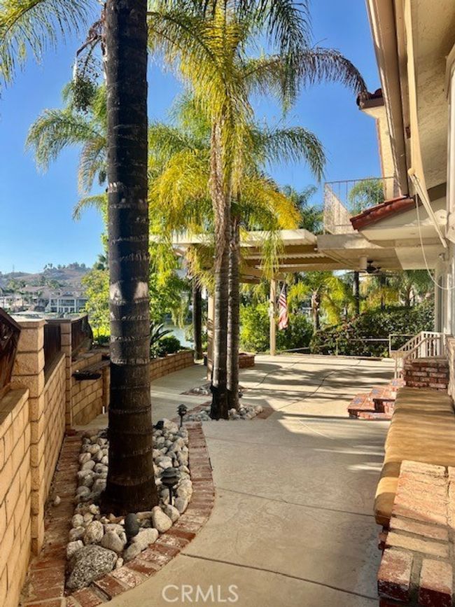 View of patio from back side yard grass area | Image 39