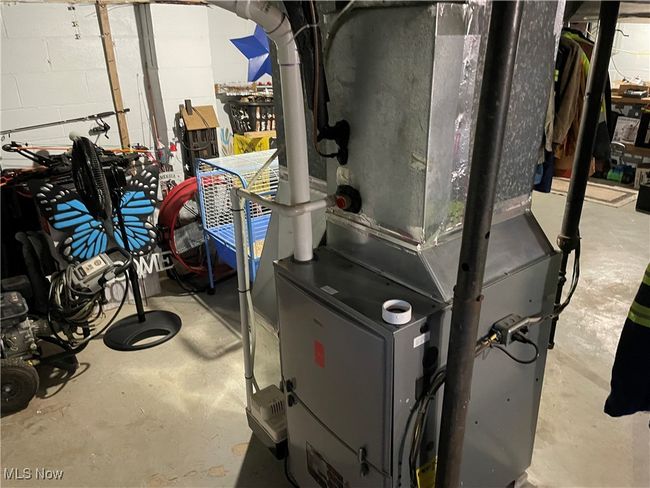 Utility room featuring heating unit | Image 30