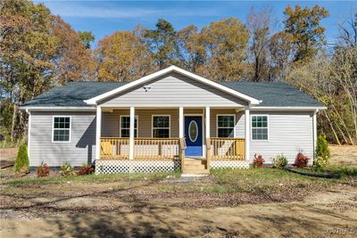 Ranch-style house with covered porch | Image 1