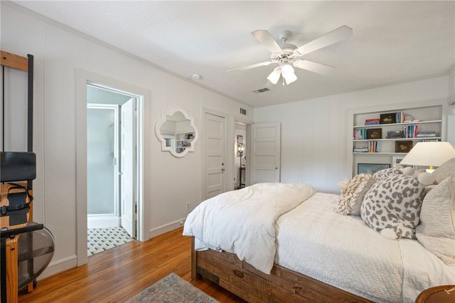 Bedroom with wood finished floors, baseboards, and ceiling fan | Image 18