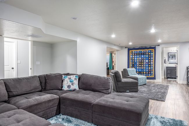 Living room featuring light hardwood / wood-style flooring | Image 32